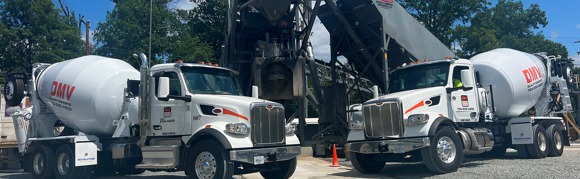 Two DMV Concrete mixer trucks loading at the batch plant