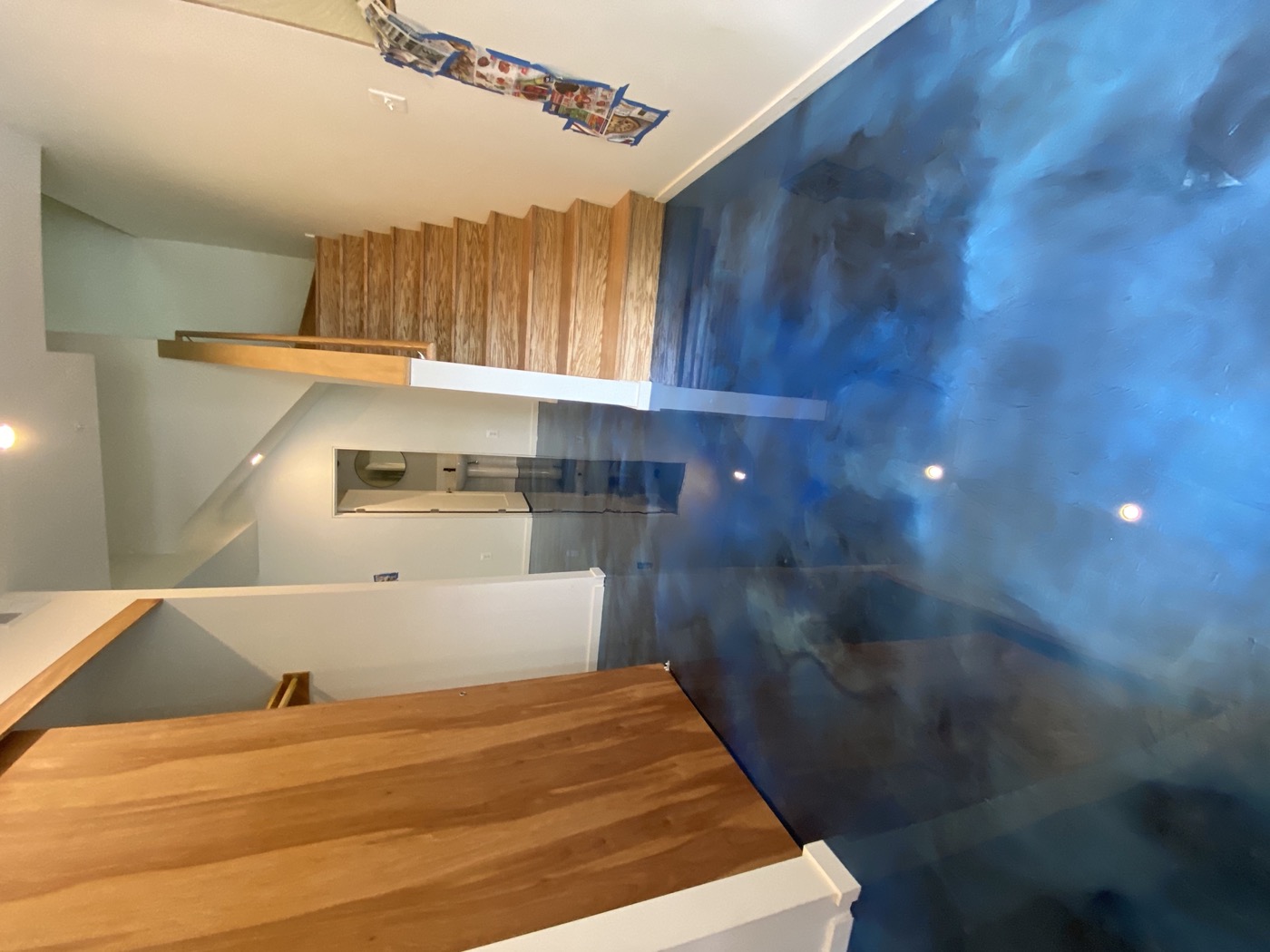 Blue metallic epoxy floor in a residential interior