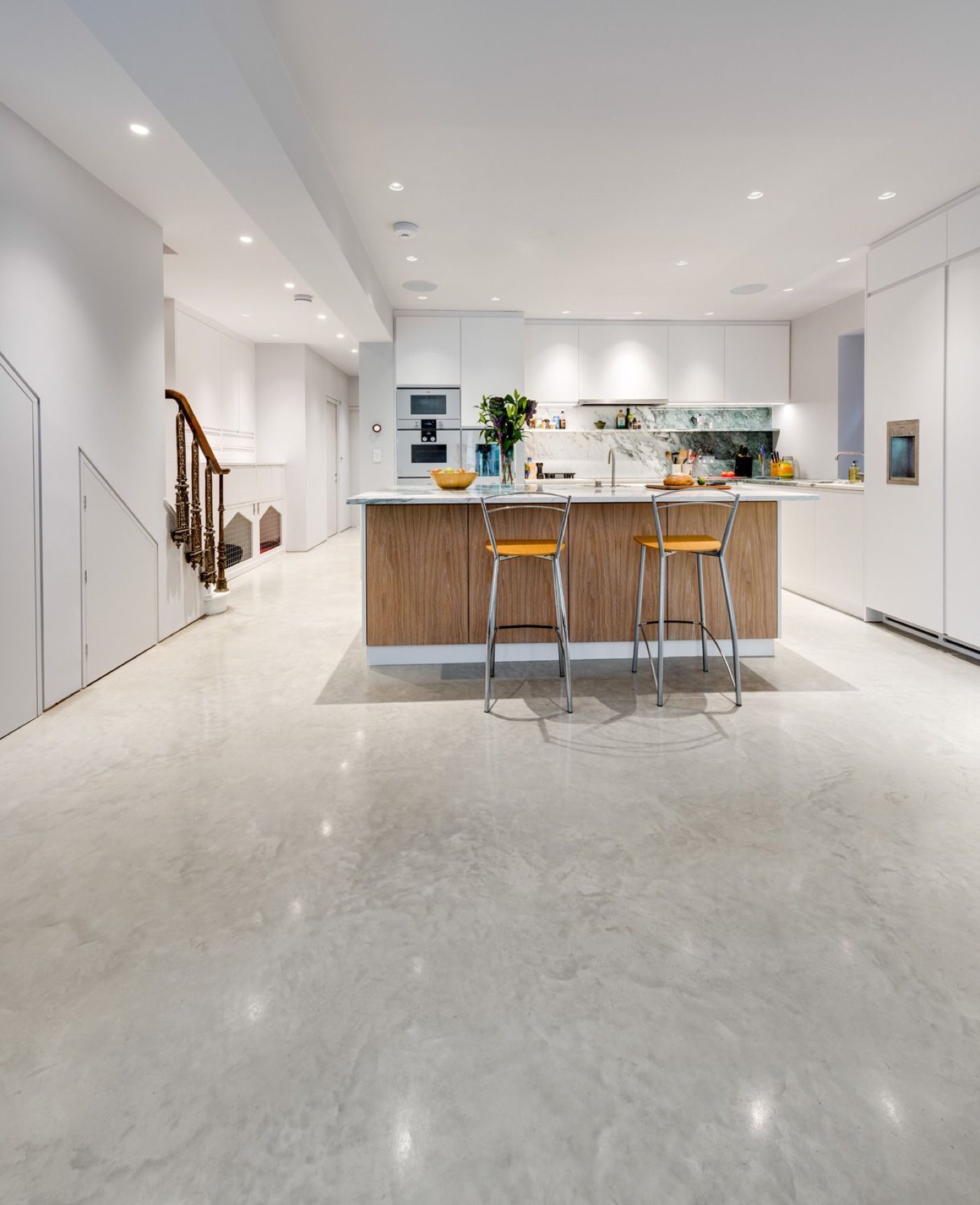 Polished concrete floor in a bright modern kitchen